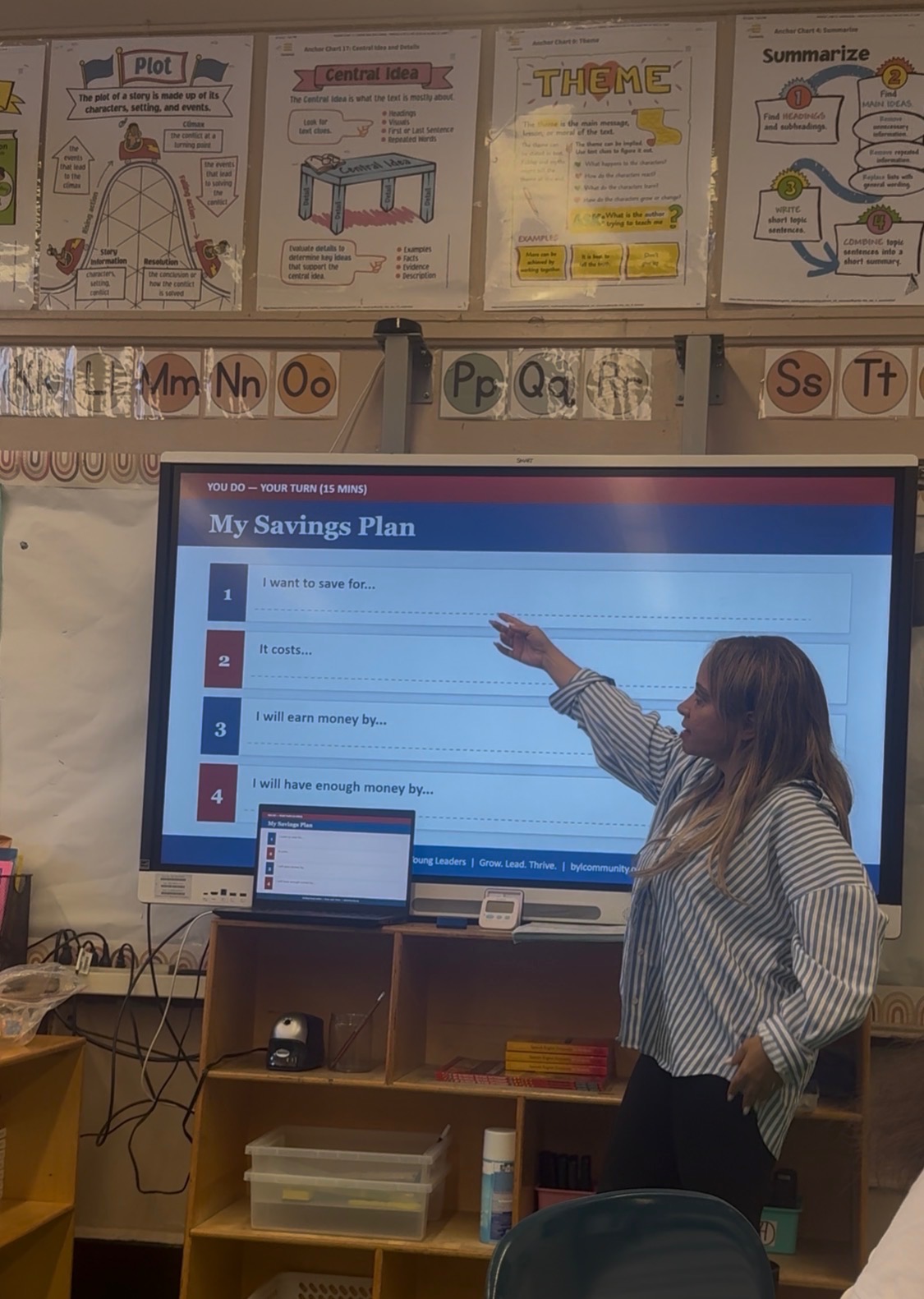 BYL educator teaching a financial literacy lesson at an after-school enrichment program